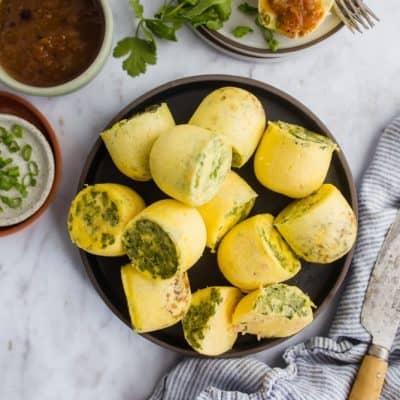 Instant Pot Egg Bites on plate with salsa and herbs.