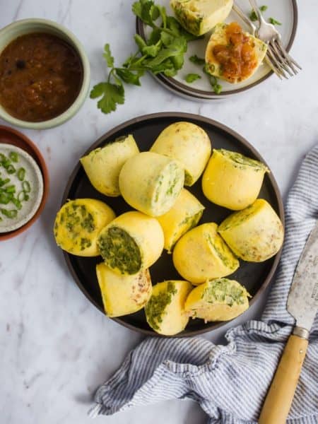 Instant Pot Egg Bites on plate with salsa and herbs.