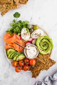 one bowl keto crackers served with veggies, lox, and eggs