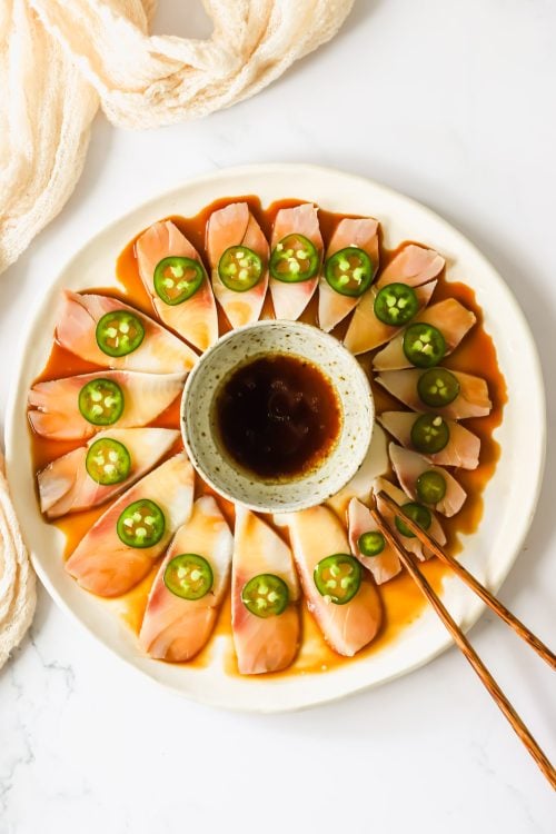 Hamachi crudo on a plate.