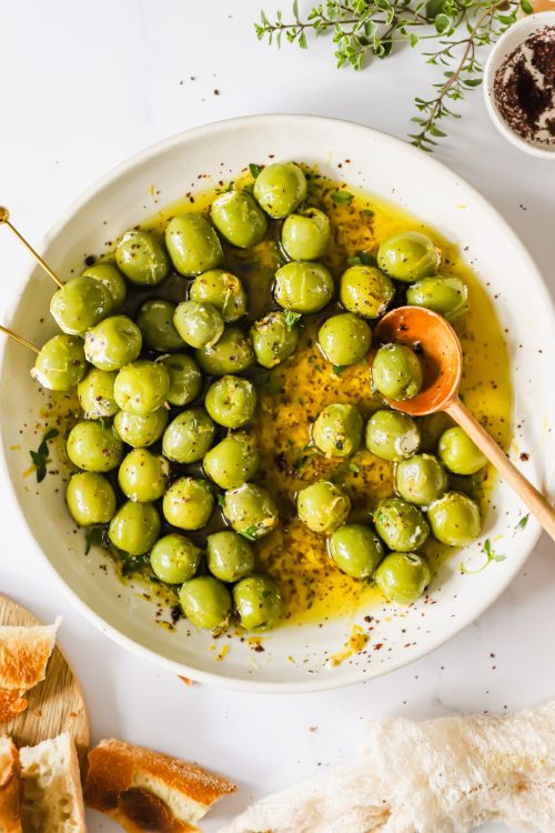 Cheese stuffed olives on a plate.
