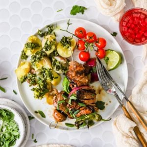 Grilled steak kabobs on a plate.