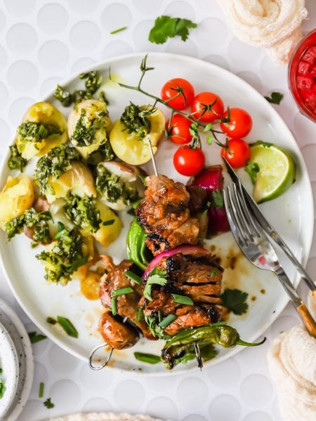 Grilled steak kabobs on a plate.