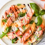 Prosciutto and melon on a plate.