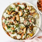 Roasted potato salad on a plate.