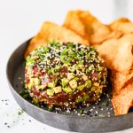 Tuna tartare on a plate with wonton chips.