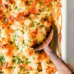 Scoop of cauliflower mac and cheese.