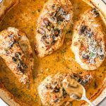 Stuffed chicken marsala in a pan.