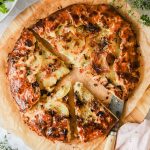 Potato galette on a cutting board.