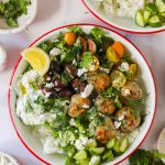 Greek chicken meatballs on a salad.