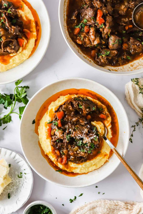 Instant Pot beef ragu on creamy polenta.