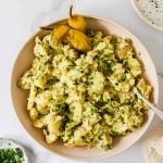 Peppers and potato salad in a serving bowl.