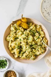 Peppers and potato salad in a serving bowl.