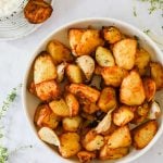 Chunks of air fried potatoes in a bowl.