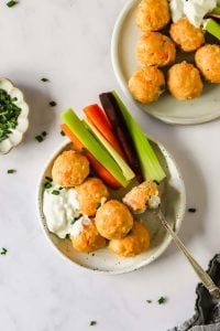 Buffalo chicken meatballs with veggies.