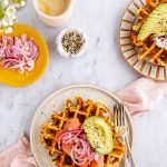 Two plates of chaffles with toppings.