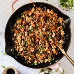 Egg roll in a bowl in a pan.
