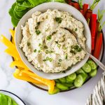 A bowl of rotisserie chicken salad with veggies.