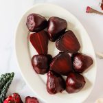 Instant pot beet halves on a plate.