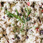 A bowl of chicken salad with diced vegetables and herbs, topped with a sprig of fresh rosemary. Text reads "Easy Chicken Salad" and "LenasKitchenBlog.com.