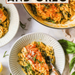 Two plates and a pot of salmon with orzo pasta, garnished with herbs, sit on a white surface. A fork rests on one plate. Text above reads “Ready in 35 minutes: Salmon and Orzo.”.