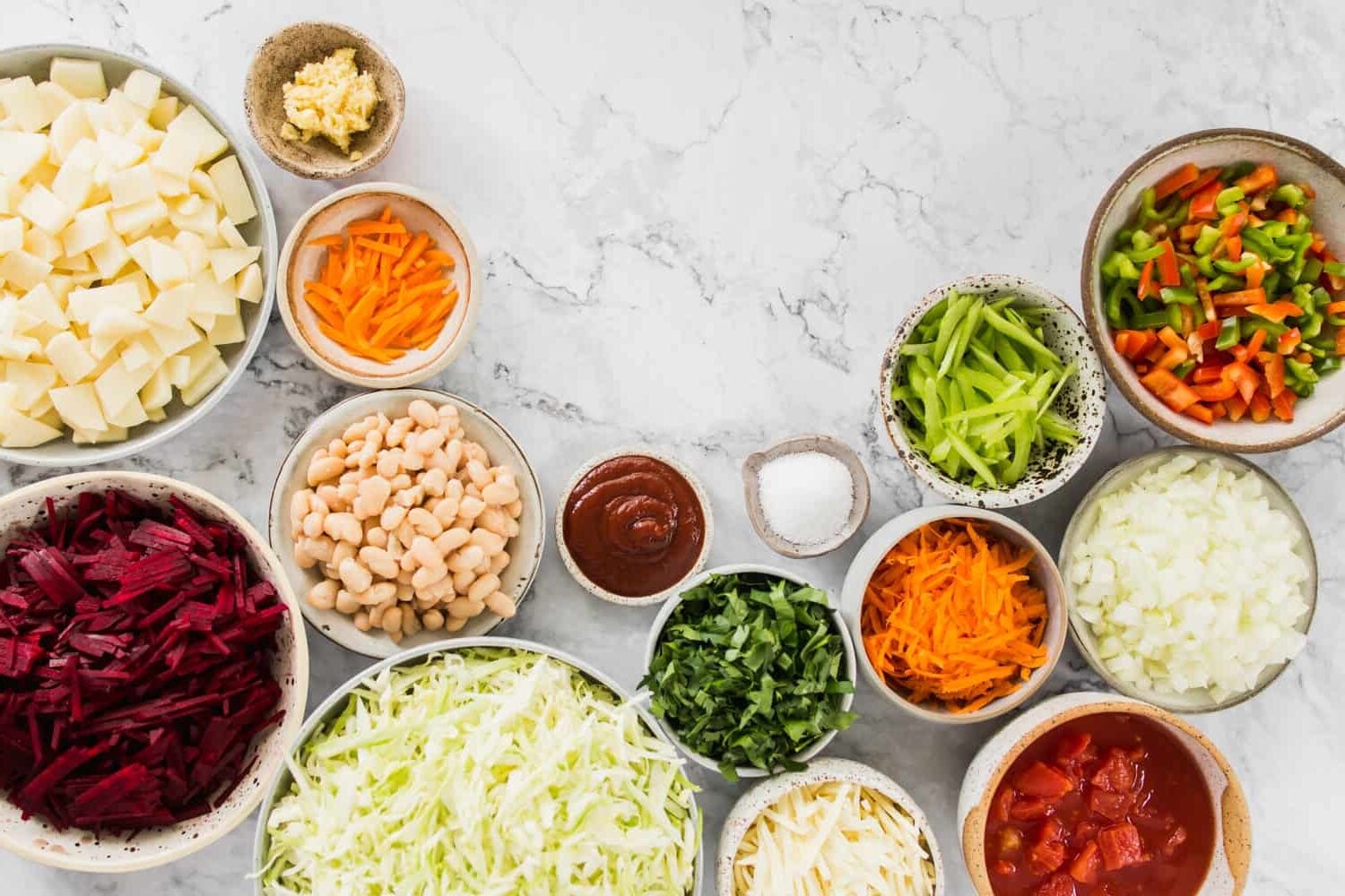 Various soup ingredients in individual bowls